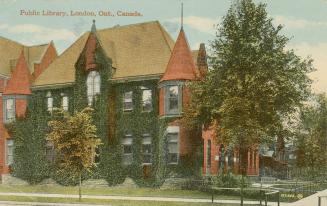 Picture of large library building covered in ivy. 