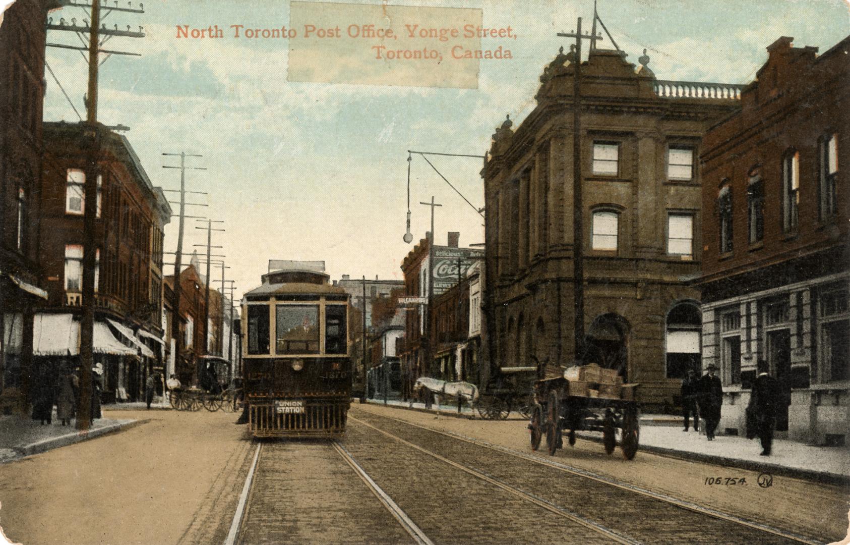 Colorized photograph of cars, buggies and streetcars on a busy city street.