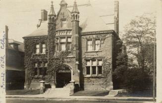 Black and white photograph of a large gothic revival style building.