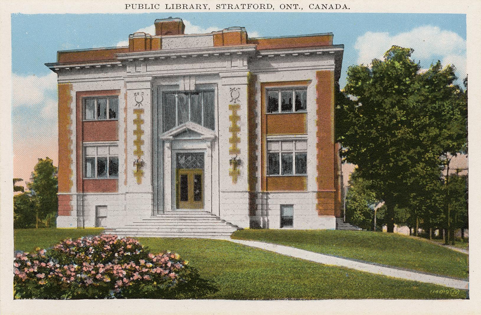 Picture of two storey library in redbrick and grey stone. 