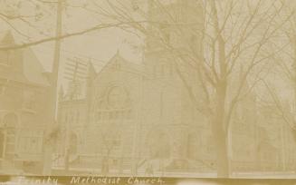 Black and white photograph of a three story church.