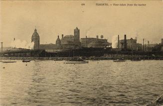 Sepia-toned photo postcard depicting the Toronto harbor with views of Union station and towers …