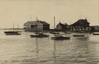 Sepia-toned photo postcard depicting boats floating on Lake Ontario with buildings in the backg…