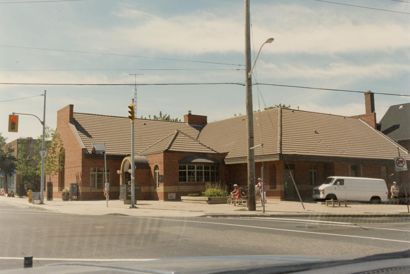 Picture of library building on street corner. 