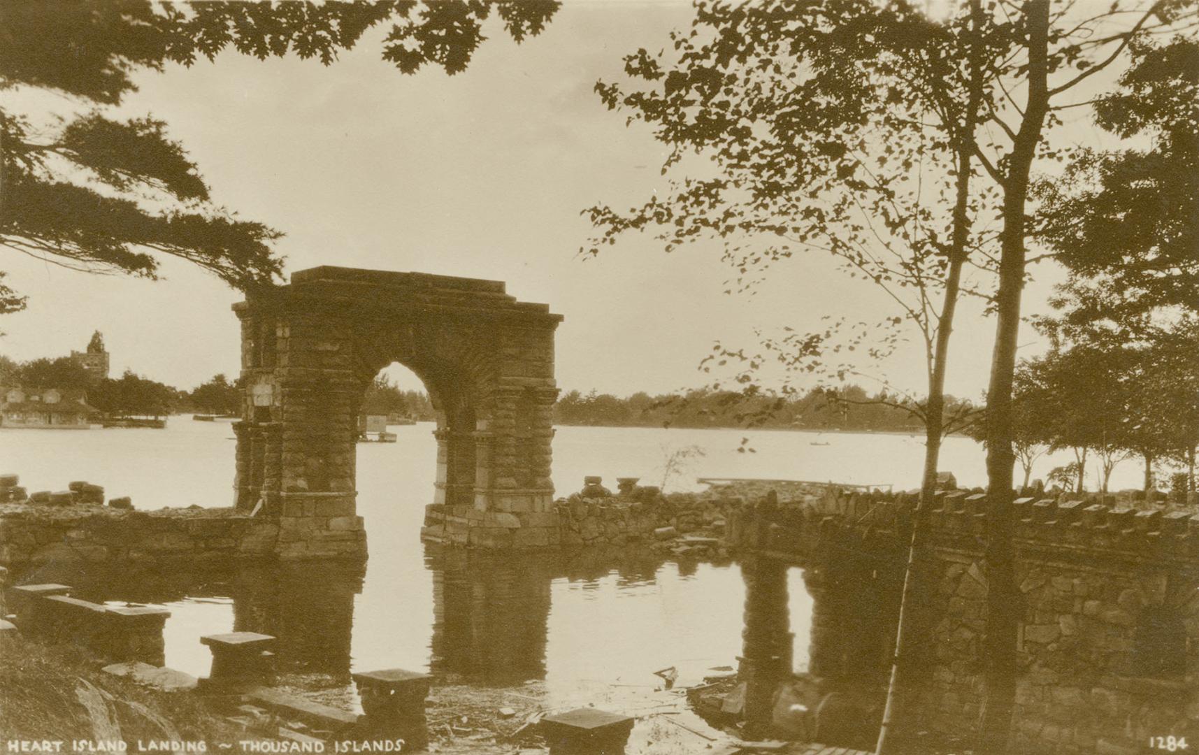 Sepia toned picture of a view of a waterway, taken from the terrace of a summer home. 