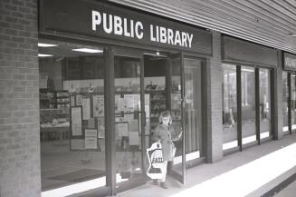 Picture of the outside of a library branch in a mall. 