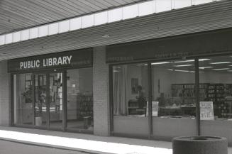 Picture of the outside of a library branch in a mall. 