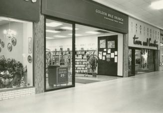 Picture of the front of a library branch inside a mall. 