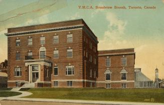 Colour postcard depicting the exterior front of a brown building with the caption at the top th…