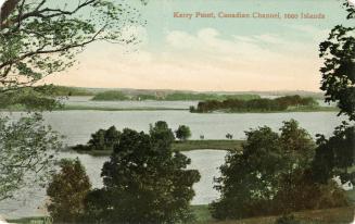 Wooded Islands in the middle of a large body of water.