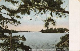 Islands in the middle of a large body of water, taken from a shoreline,