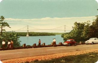 Colorized photograph of people who have step out of their automobiles to look at the view of an…