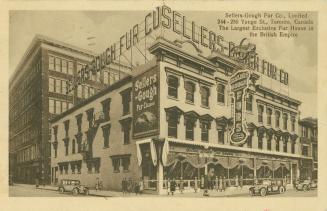 Sepia-toned postcard depicting the exterior corner of a 3-story fur store on Yonge Street. Ther…