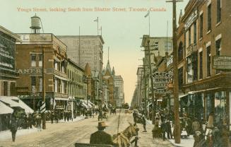 Colour postcard depicting a view of Yonge Street with horse-drawn buggies, many shops, and pede…