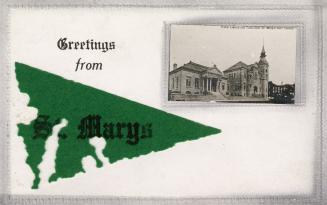 Green felt flag with wording and small photo of library and town hall in upper right corner of …