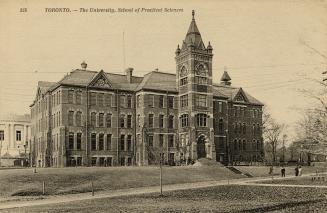 Black and white photo postcard (now sepia-toned) depicting the rear entrance of a large buildin…