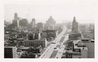 Black and white photo postcard depicting a view looking south on University Avenue towards the …