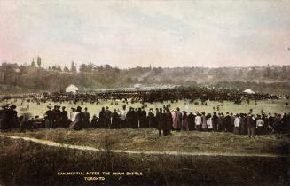 Colour photo postcard depicting many military personnel in a large field at Don Valley with spe…