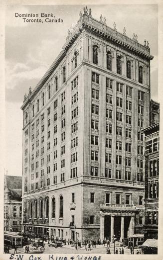 Black and white photo postcard depicting the exterior view looking south on Yonge from King Str…