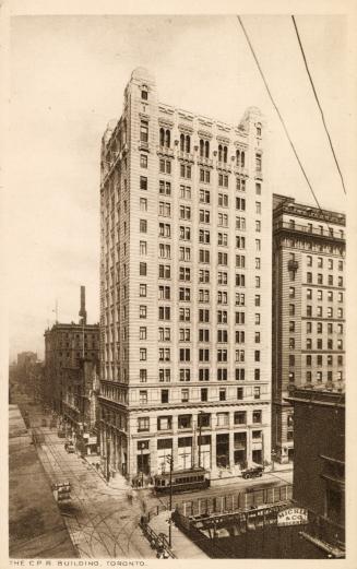 Sepia-toned photo postcard depicting the exterior view looking east on King Street from Yonge, …