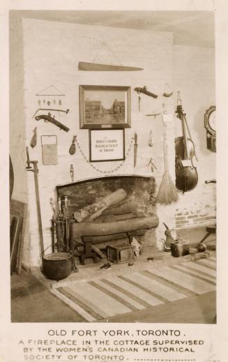 Sepia toned photograph of logs in a fireplace, surrounded by objects.