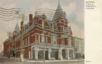 Colorized photograph of a large building constructed in the Richardsonian Romanesque style of a…