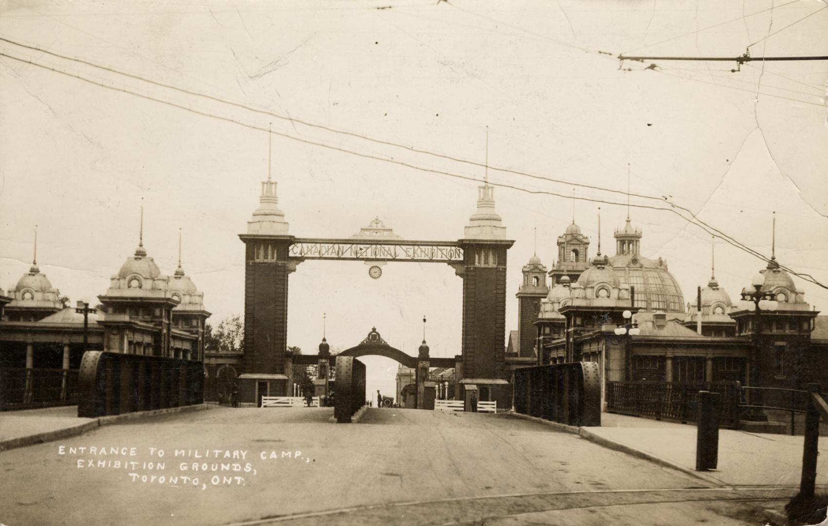 Sepia-toned photo postcard depicting the entrance of the Canadian National Exhibition Dufferin …