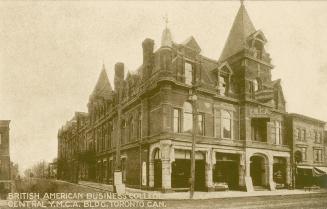 Black and white photograph of a large building in the Richardsonian Romanesque style of archite…