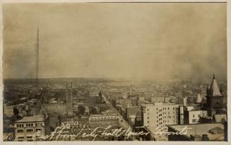 Black and white photo postcard depicting an aerial view of Toronto showing the Metropolitan Met…