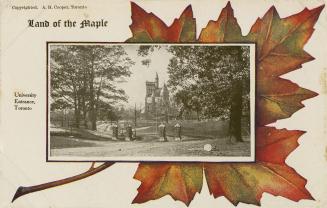 Black and white photograph of a formal gate with a large Victorian style building in the backgr…