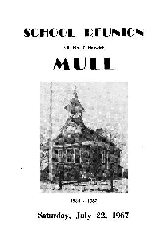 A black and white photograph of a small brick school house, with two staircases leading to the  ...