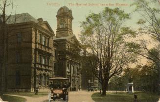 Colorized photograph of a large, three story, white stone, Victorian building with a cupola tow ...