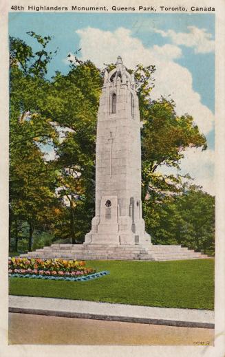 Picture of a large monument with several figures surrounded by trees. 