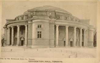 Black and white photograph of a large Beaux-Arts building with a domed roof.