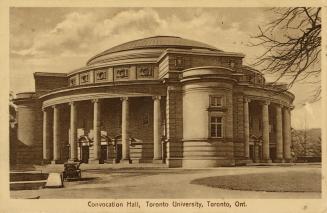 Black and white photograph of a large Beaux-Arts building with a domed roof.