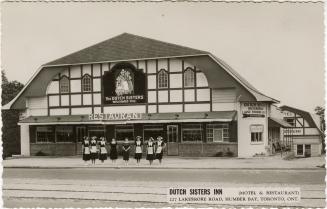 Black and White photo postcard depicting a restaurant-motel, with caption at the bottom of the …