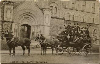 Black and white photograph of eighteen people on a horse drawn carriage in front of an elaborat ...