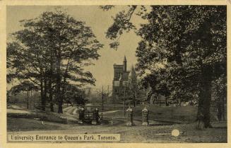 Black and white photograph of an open gate in an iron rail fence. In the background are large,  ...