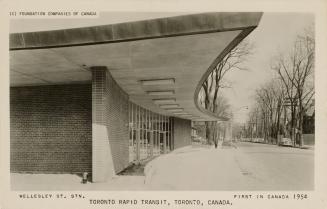 Black and white of an entrance way with a cantilever overhang.