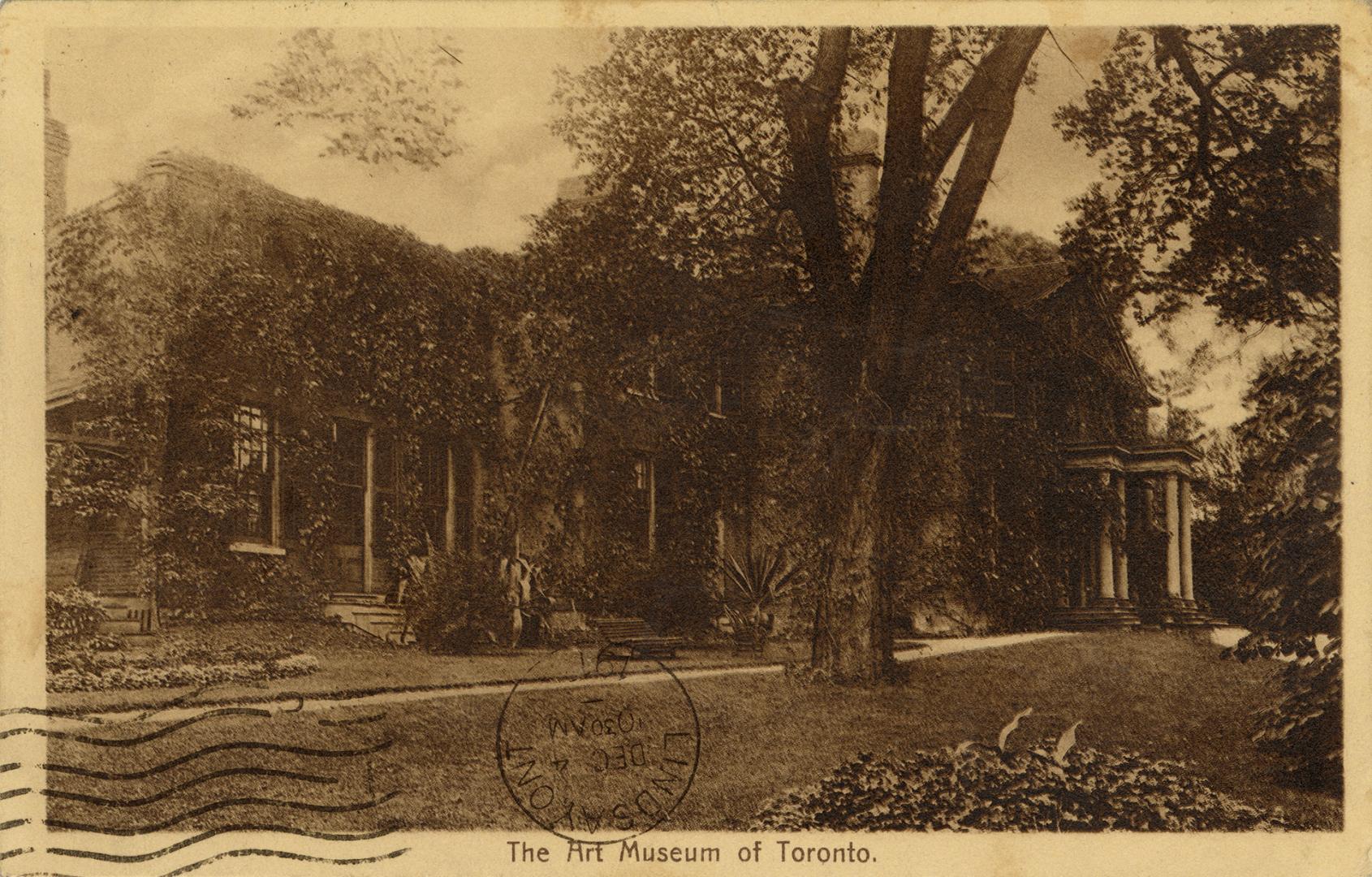 Sepia toned photograph of a large Georgian house with trees in front of it.