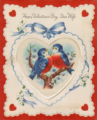 At the centre of the card is a heart-shaped silk insert. It pictures two blue birds with red br…